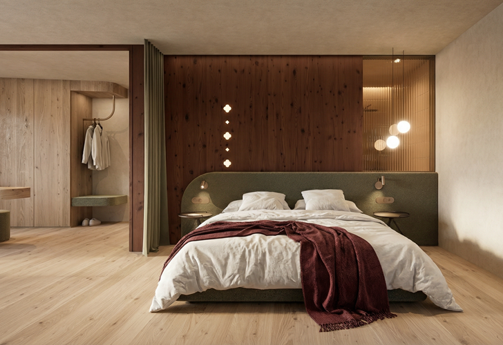 Modern bedroom with a cosy double bed, warm lighting, wooden elements and an integrated walk-in wardrobe.