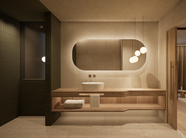 Warm beleuchtetes Badezimmer mit Waschbecken, einem großen Spiegel und Sitzmöglichkeit.